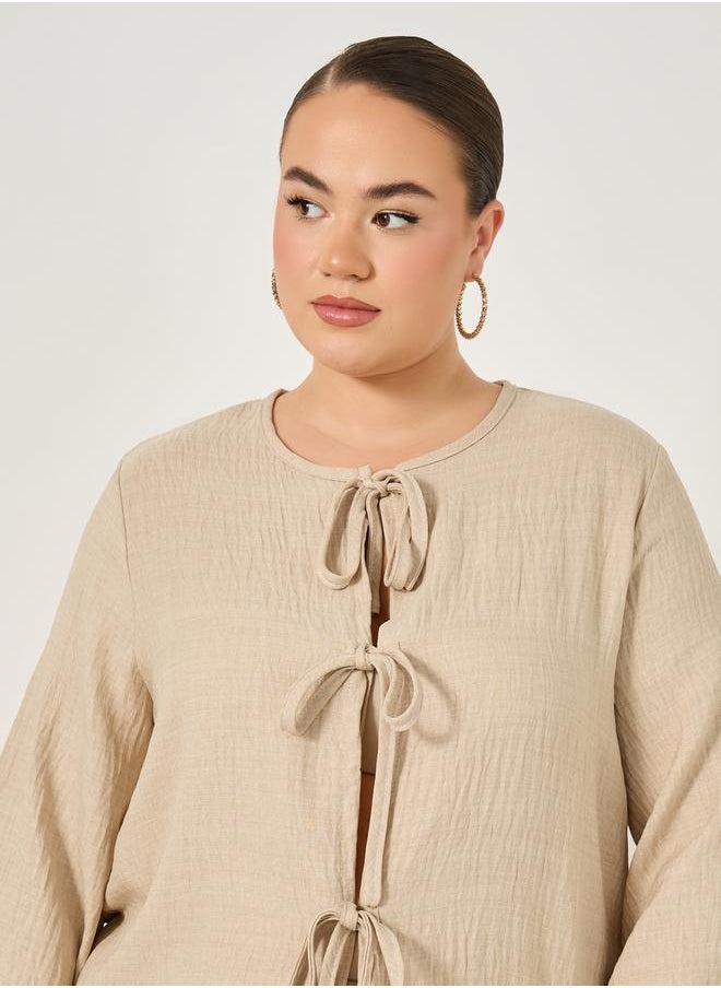 Styli Plus Size Textured Balloon Sleeve Blouse with Bow Tie-Up Detail  - Image 3