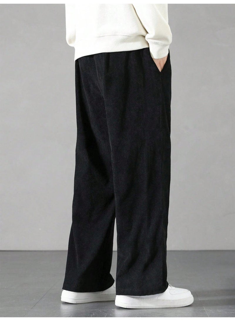 بنطلون رجالي أسود من قماش الكوردروي، واسع الساقين، بنسيج مضلع، بقصة فضفاضة، برباط، مناسب للإطلالات الكاجوال. - Image 3