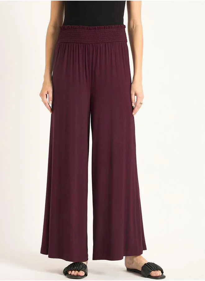 Femmella Knitted Smocking Detail Flared Pants by Styli