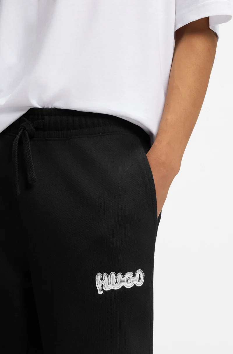 HUGO Cotton-terry tracksuit bottoms with logo print