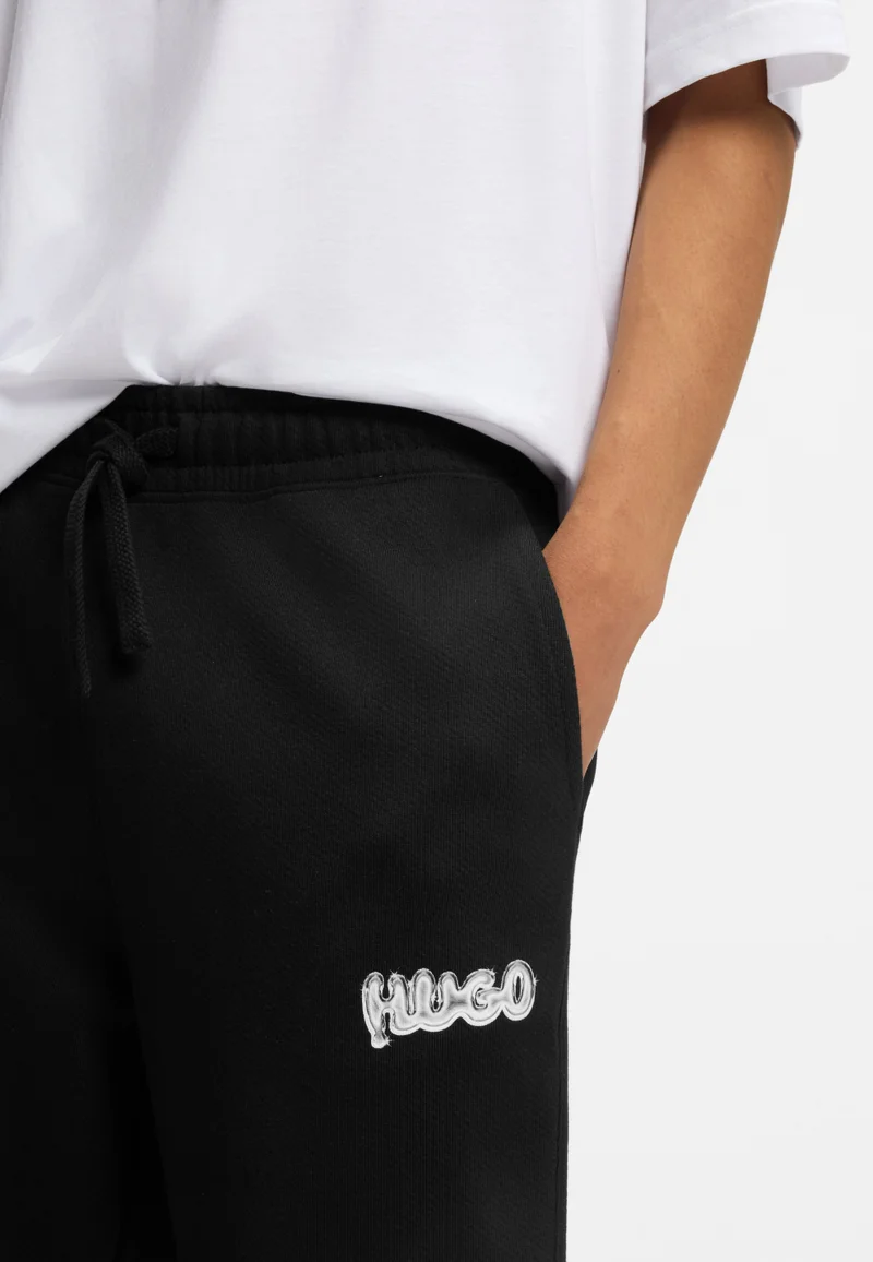 HUGO Cotton-terry tracksuit bottoms with logo print