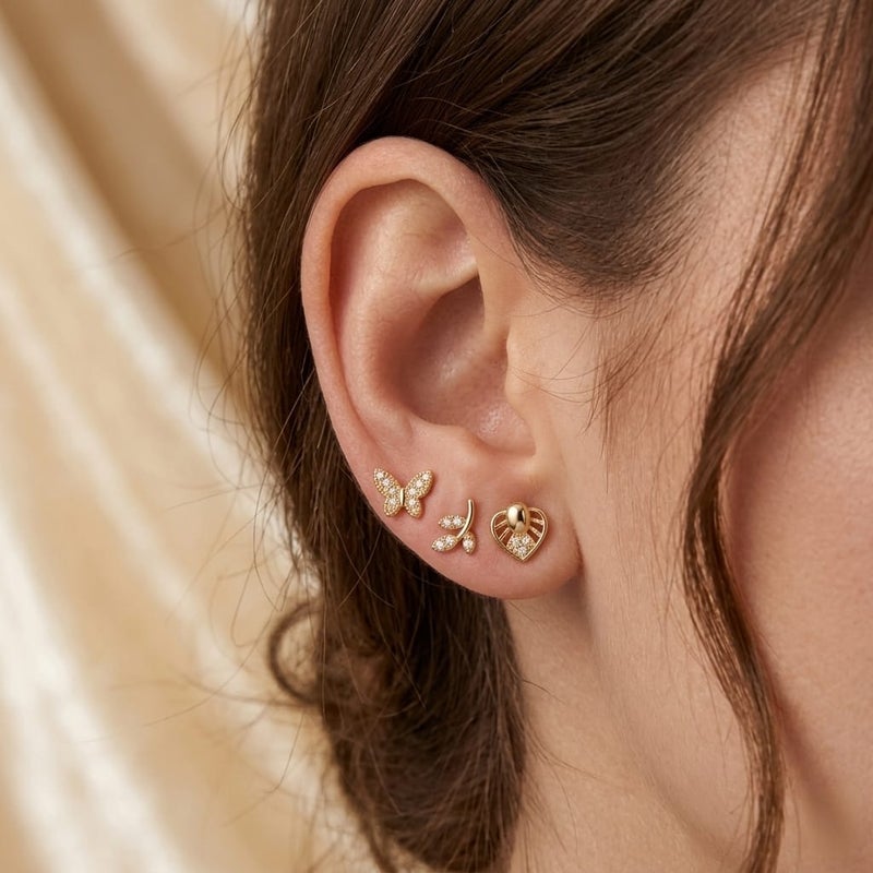 A set of 3 pairs of stud earrings in enchanting designs (butterfly, delicate branch, and sparkling heart) adorned with brilliant cubic zirconia stones. Shine with everyday versatility that combines luxury and elegance! - Image 2