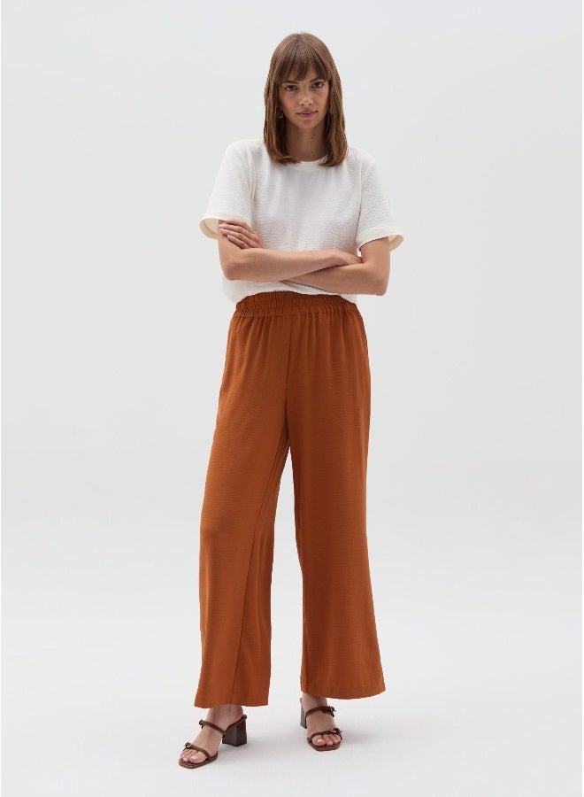 او في اس Crinkle-effect fluid trousers - Image 1