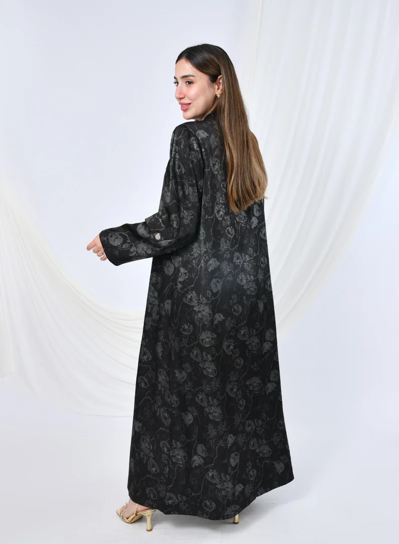 HAWRAA ABAYA Elegant silk abaya with gray floral print, buttons, and a sophisticated shiny finish.