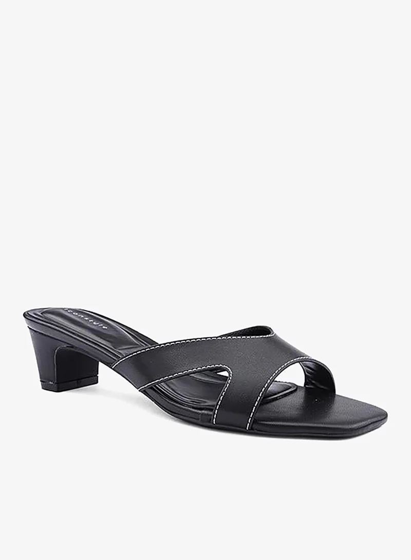 أيقون صنادل بكعب مزينة بأشرطة