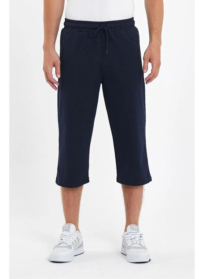 Men's Navy Blue Knee-Length Bermuda Capri Long Shorts with Zippered Pockets and Adjustable Elastic Waist.