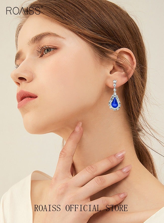 رويس طقم مجوهرات للعروس مكون من قطعتين مرصع بالألماس بالكامل، يتضمن قلادة على شكل دمعة على شكل حرف V وأقراط متناسقة. تصميم أنيق مثالي لحفلات الزفاف والمناسبات الرسمية والخاصة. اللون: أزرق - Image 3