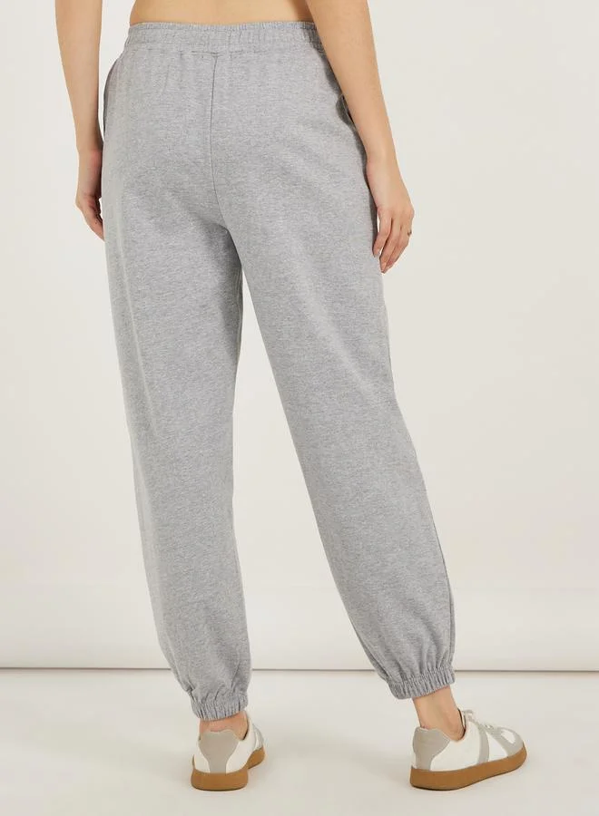 ستايلي High Rise Cross Waistband Tapered Leg Joggers