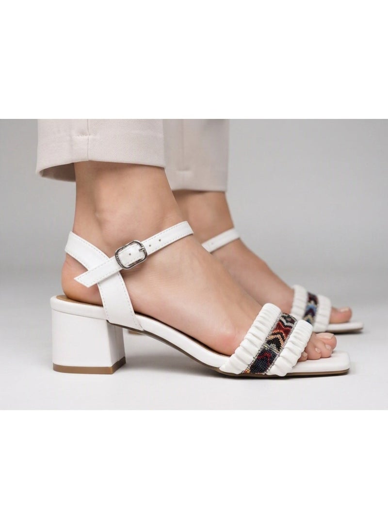 Women's sandals with a wide heel, decorated with a colorful crystal-embroidered front strap. - Image 1