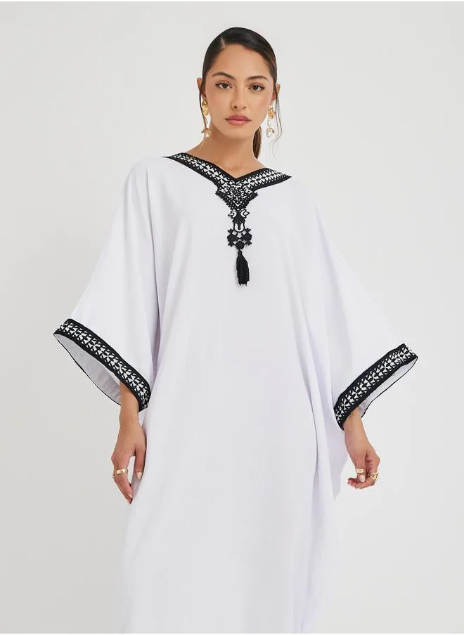 أميرة Amirah Loose Fit Batwing Sleeve Embroidered Jalabiya with Tassel Detail