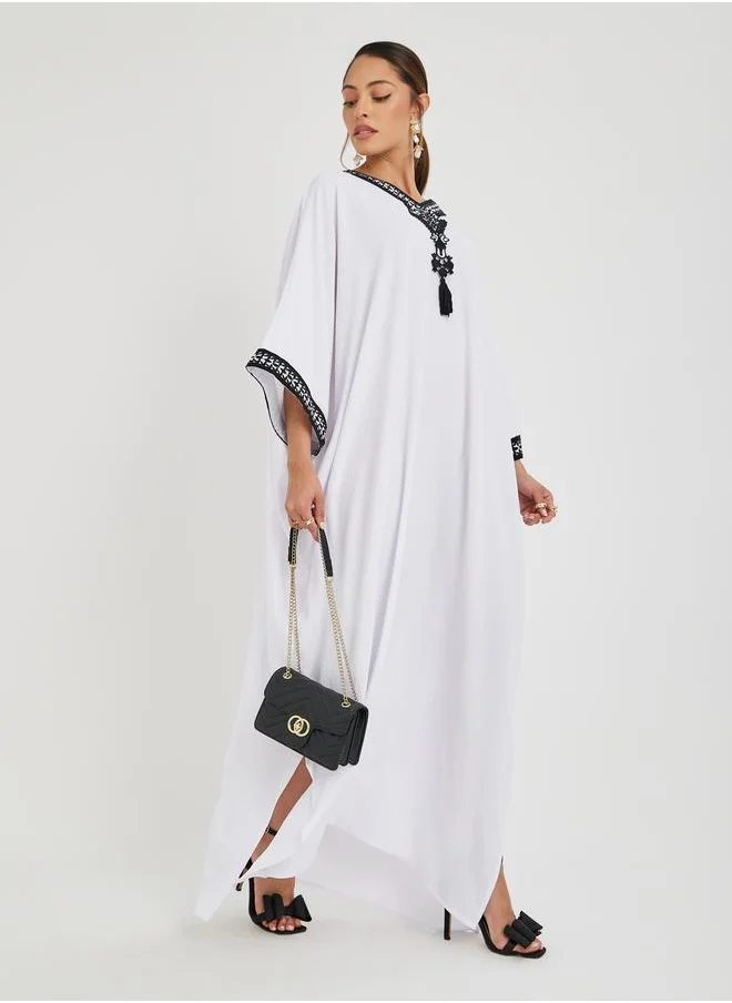 أميرة Amirah Loose Fit Batwing Sleeve Embroidered Jalabiya with Tassel Detail