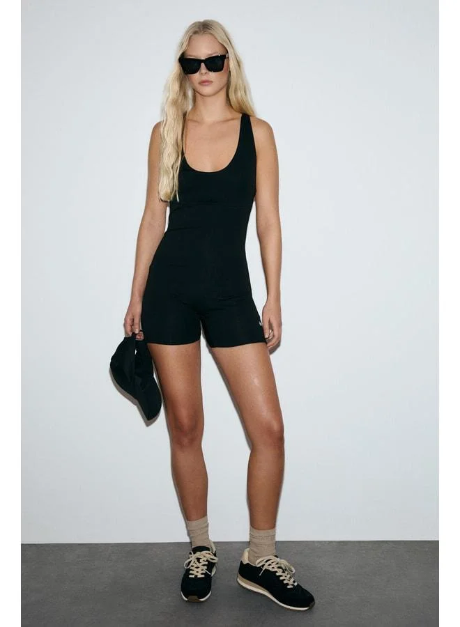 Urban Beat LUNARA Women's Soft and Stretchy Fabric Fitted Short Black Jumpsuit.