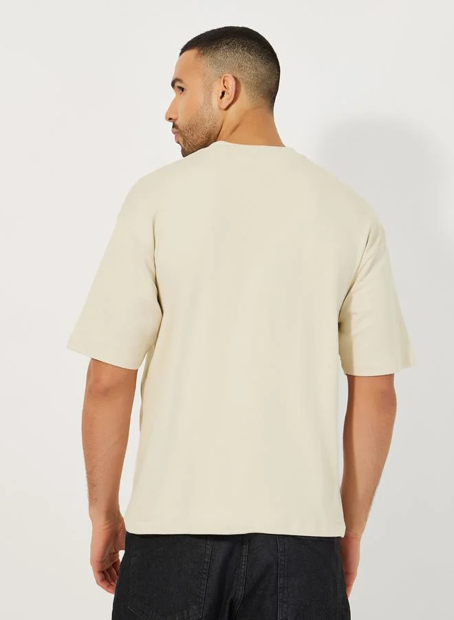 Styli Oversized Interlock Emboss Print T-Shirt