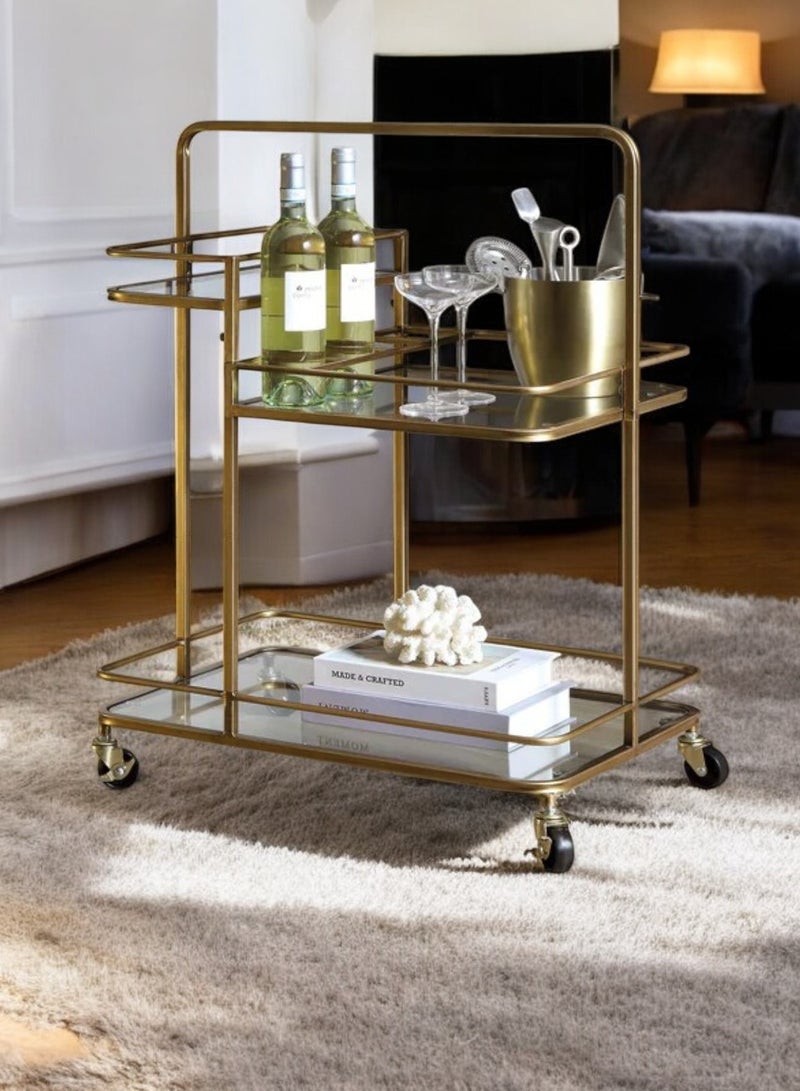 fan baytk This 3-Tier Glass Serving Cart with Wheels is a beautiful vintage inspired serving cart perfect for those who love botanical details and shiny gold furniture. This serving cart comes in a 3-tier design, with 4 bottle/cup holders. It features a gold finish and attractive details. - Image 1