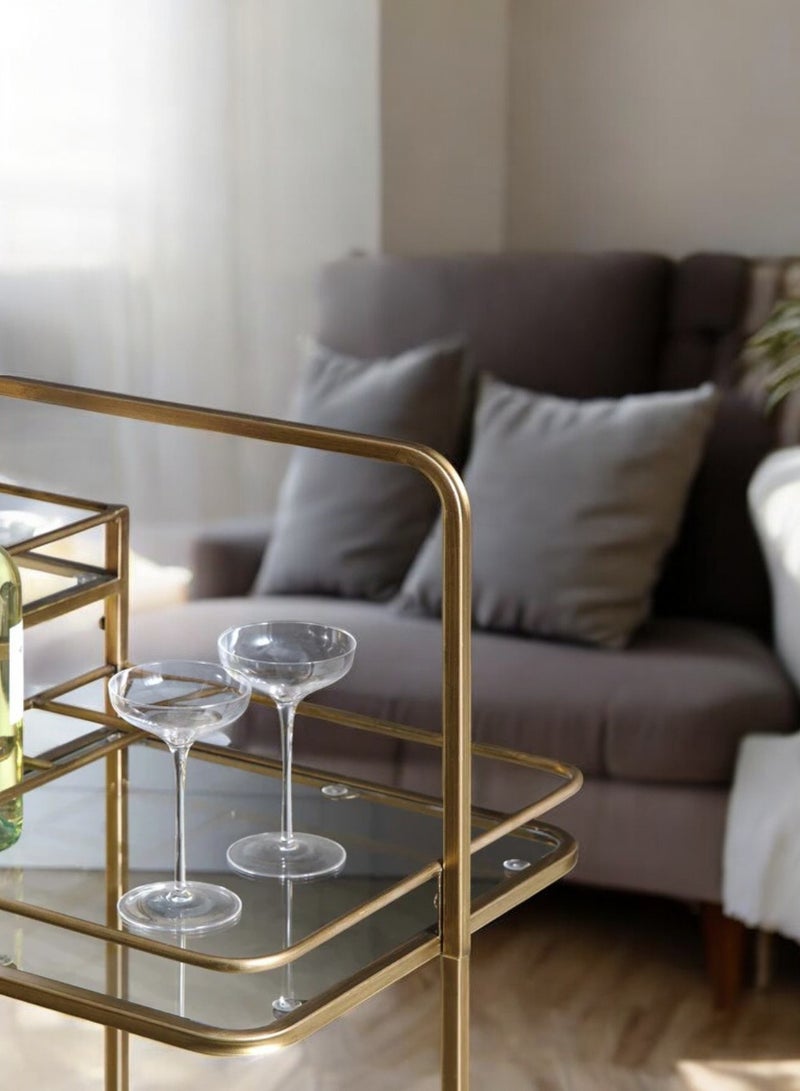 fan baytk This 3-Tier Glass Serving Cart with Wheels is a beautiful vintage inspired serving cart perfect for those who love botanical details and shiny gold furniture. This serving cart comes in a 3-tier design, with 4 bottle/cup holders. It features a gold finish and attractive details. - Image 3