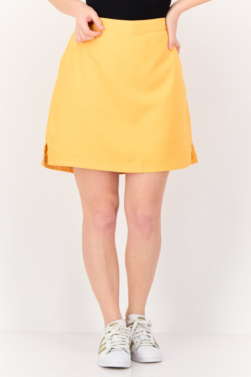 Greg Norman تنورة تدريب مثالية للنساء، برتقالية - Image 1