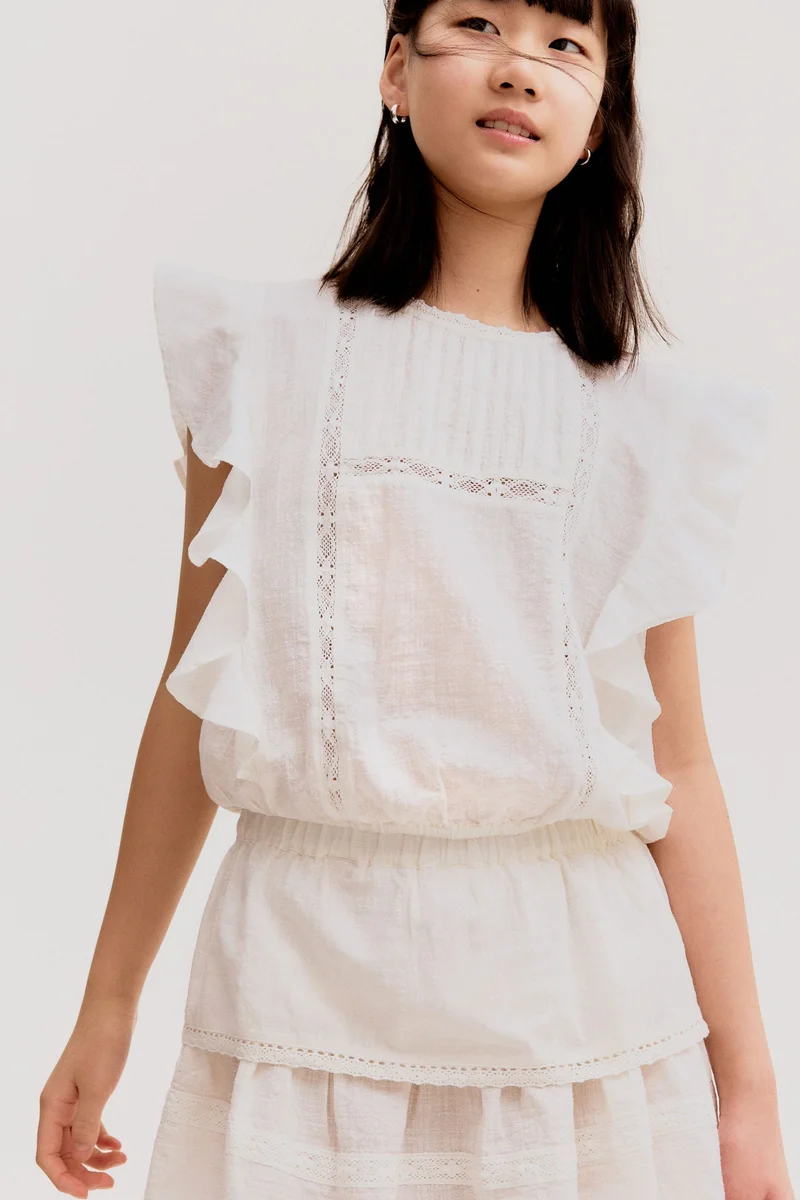 اتش اند ام تنورة قطنية بحواف دانتيل