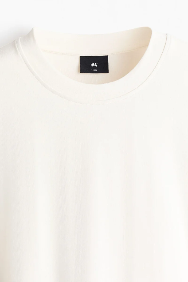 اتش اند ام تي-شيرت بقصة فضفاضة بأكمام طويلة