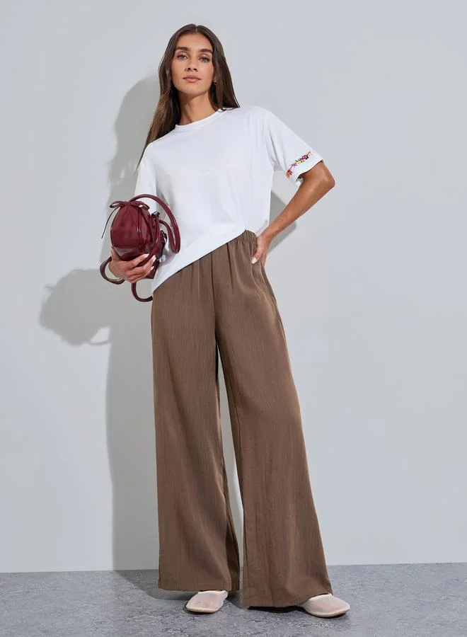 ستايلي Brown Solid Wide Leg Pants