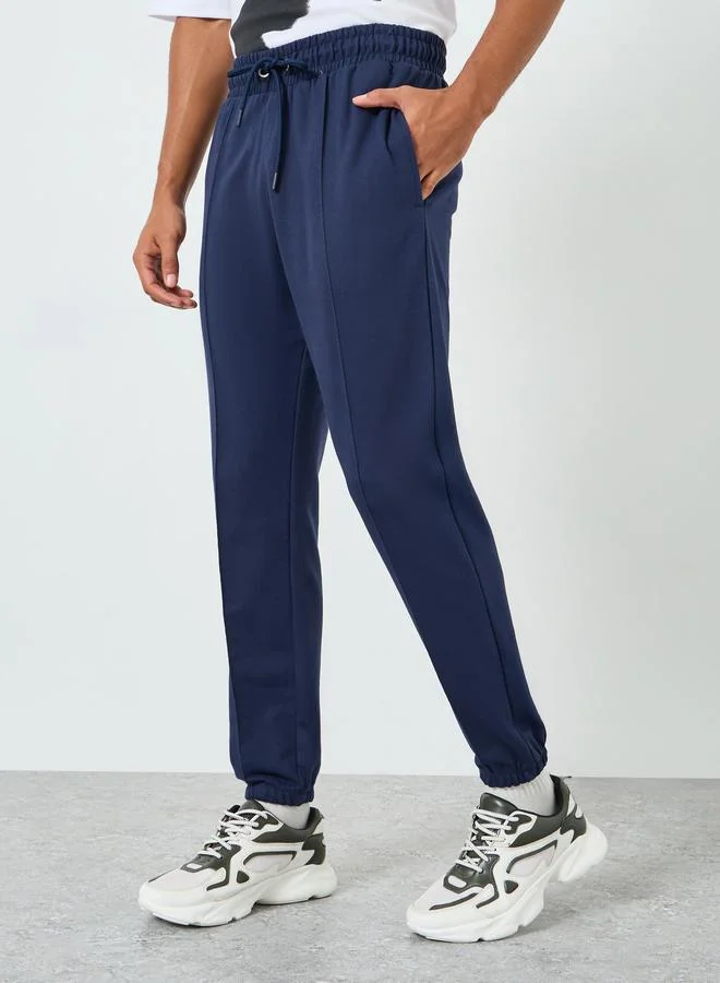Men Navy Blue Solid Joggers with Pintuck Detail