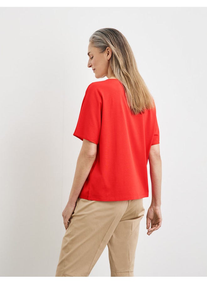 Blouse top with an inverted pleat