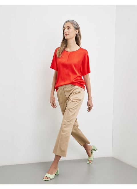 Blouse top with an inverted pleat
