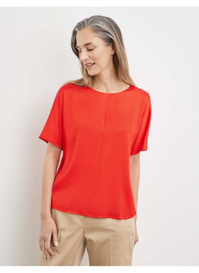 Blouse top with an inverted pleat