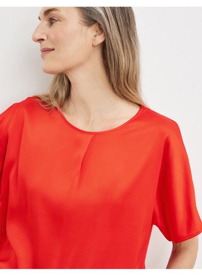 Blouse top with an inverted pleat