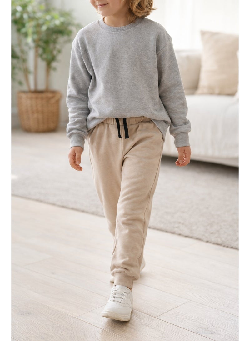 شي إن بنطلون جوجر أطفال لون بيج مناسب للبنات والأولاد، بخصر استك ورباط لراحة وثبات أفضل، خامة ناعمة ومريحة، مثالي للبس اليومي والخروج والكاجوال. - Image 5