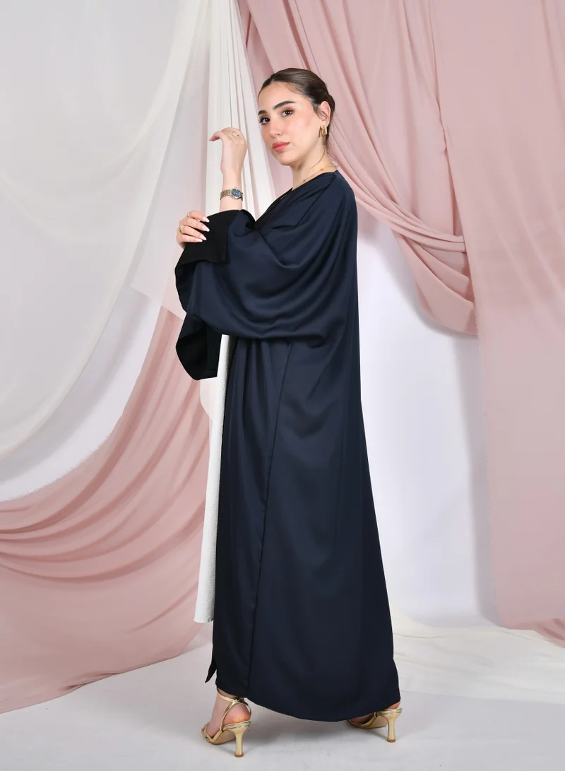 HAWRAA ABAYA Double-faced wrap abaya in black and navy blue with wide sleeves