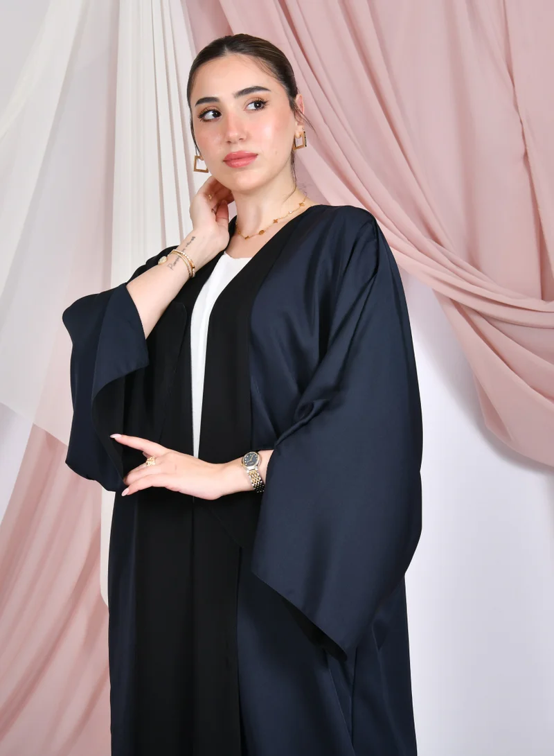 HAWRAA ABAYA Double-faced wrap abaya in black and navy blue with wide sleeves