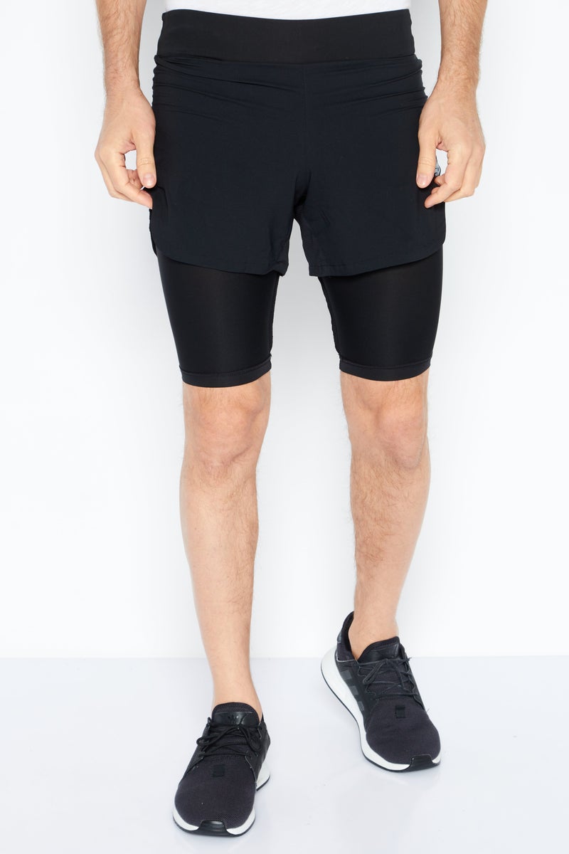 New Balance شورت تدريب رجالي رياضي برباط، أسود - Image 1