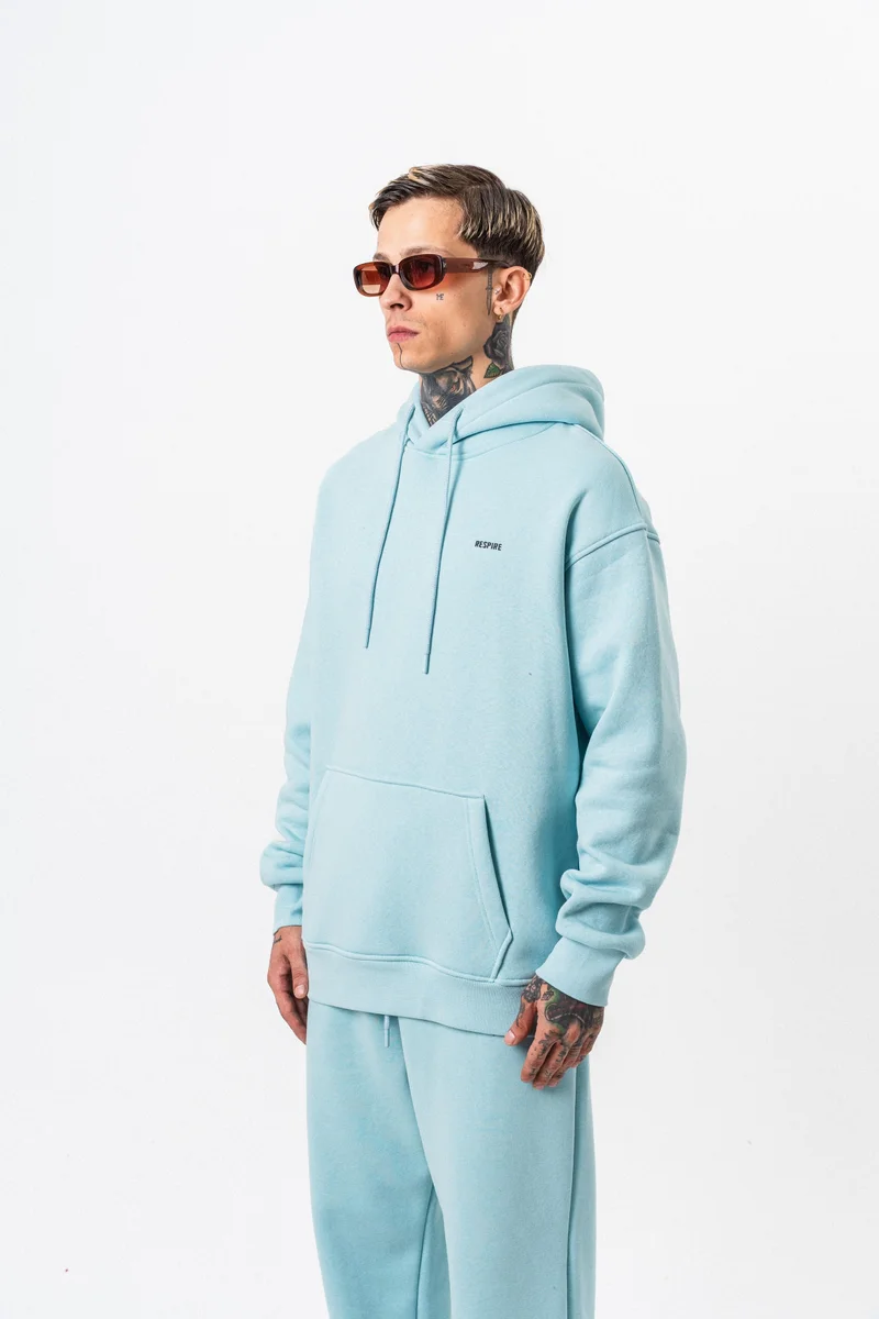 ريسباير هودي رجالي أساسي واسع (Oversize) بغطاء رأس بتفاصيل نص "Respire" لون أزرق فاتح