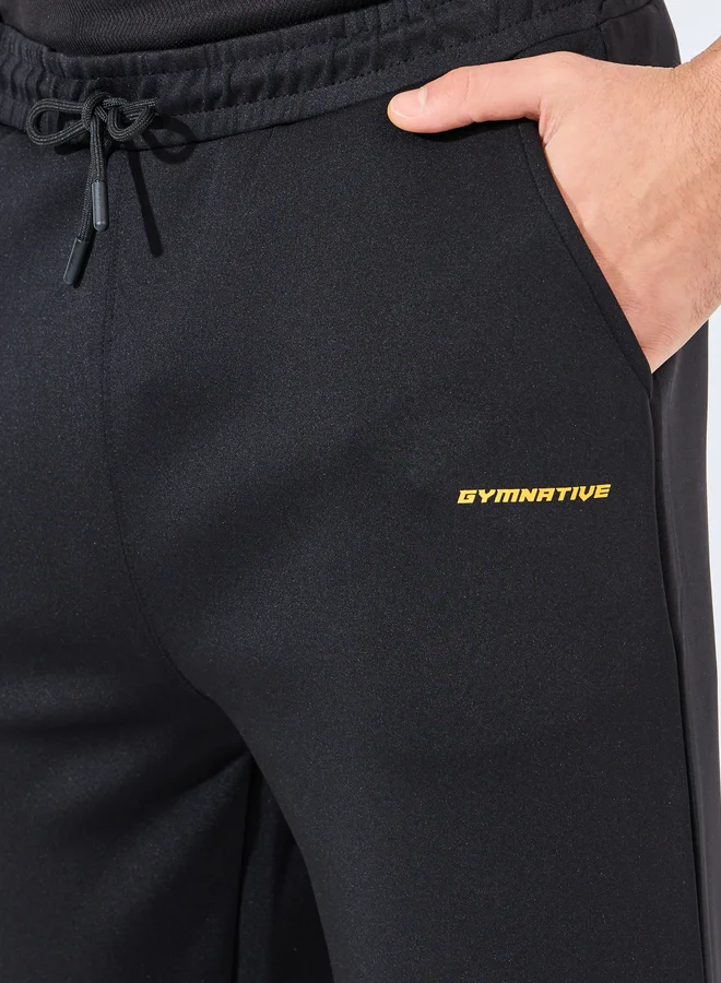 Styli Styli Relaxed Fit Open Hem Scuba Pants With Bottom Snap Detail