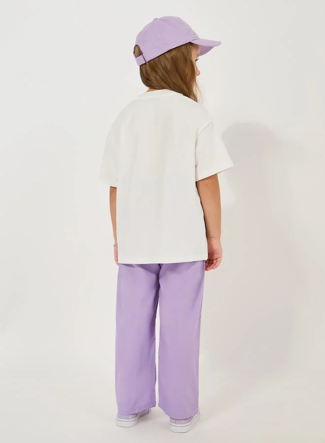 Styli Graphic Print Oversized T-Shirt & Solid Pants Set