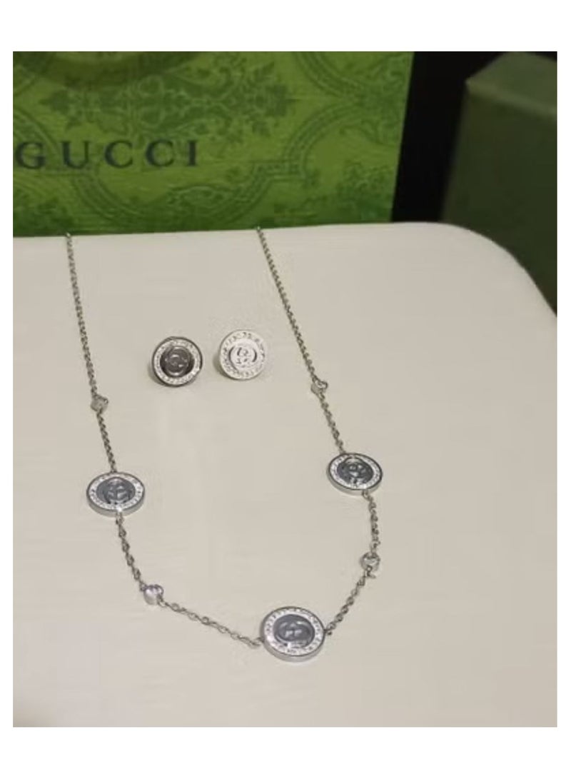 CO Silver necklace and earring set with accessories and warranty card