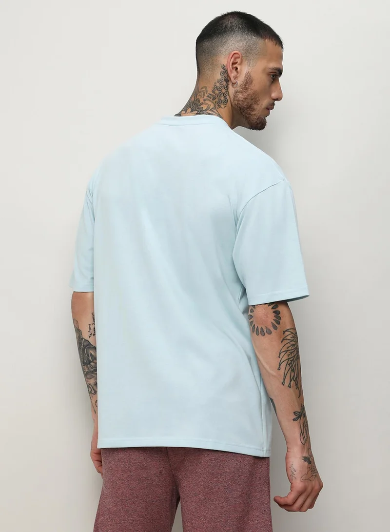 Campus Sutra Campus Sutra Men's Powder Blue Oversized Basic T-Shirt For Casual Wear | Crew Neck | Short Sleeve | Pull On Closure | T-Shirt Crafted With Comfort Fit For Casual Wear