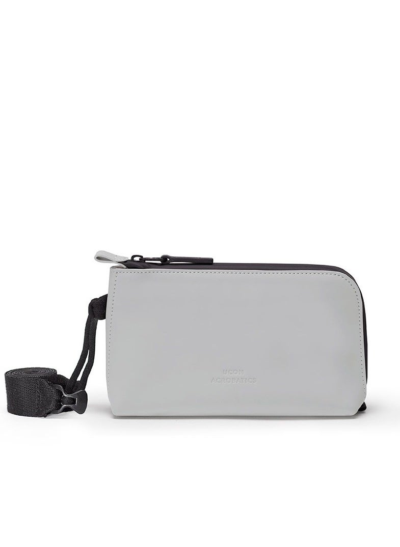UCON ACROBATICS Ucon Acrobatics, Otis Bag, Lotus Series, Light Grey, Stylish Minimalist Design, Compact Zipped Compartment, Waterproof, Adjustable Drawstring, 2 Pockets, Hand, Crossbody or Shoulder Strap Wear, 1L  - Image 1