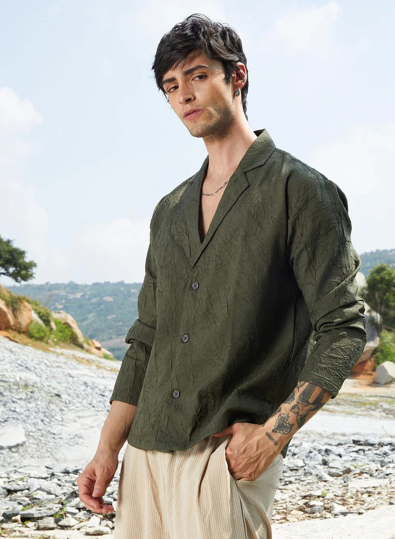Campus Sutra Men's Army Green Wrinked Korean Oversized Shirt For Casual Wear | Lapel Collar | Long Sleeve | Button Closure | Oversized Shirt Crafted With Comfort Fit For Everyday Wear