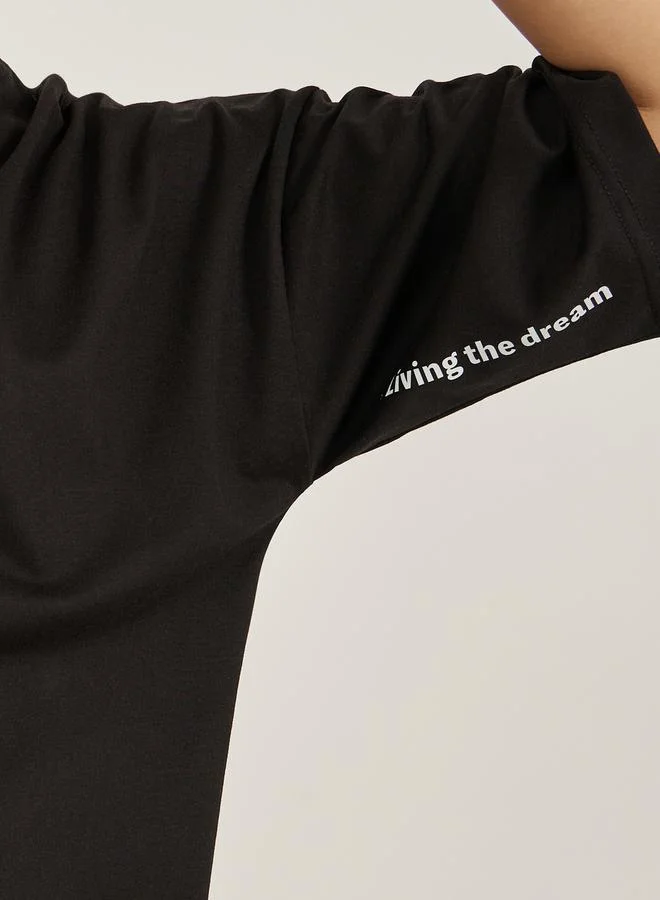 ستايلي Slogan Print Dropped Shoulder Oversized T-Shirt