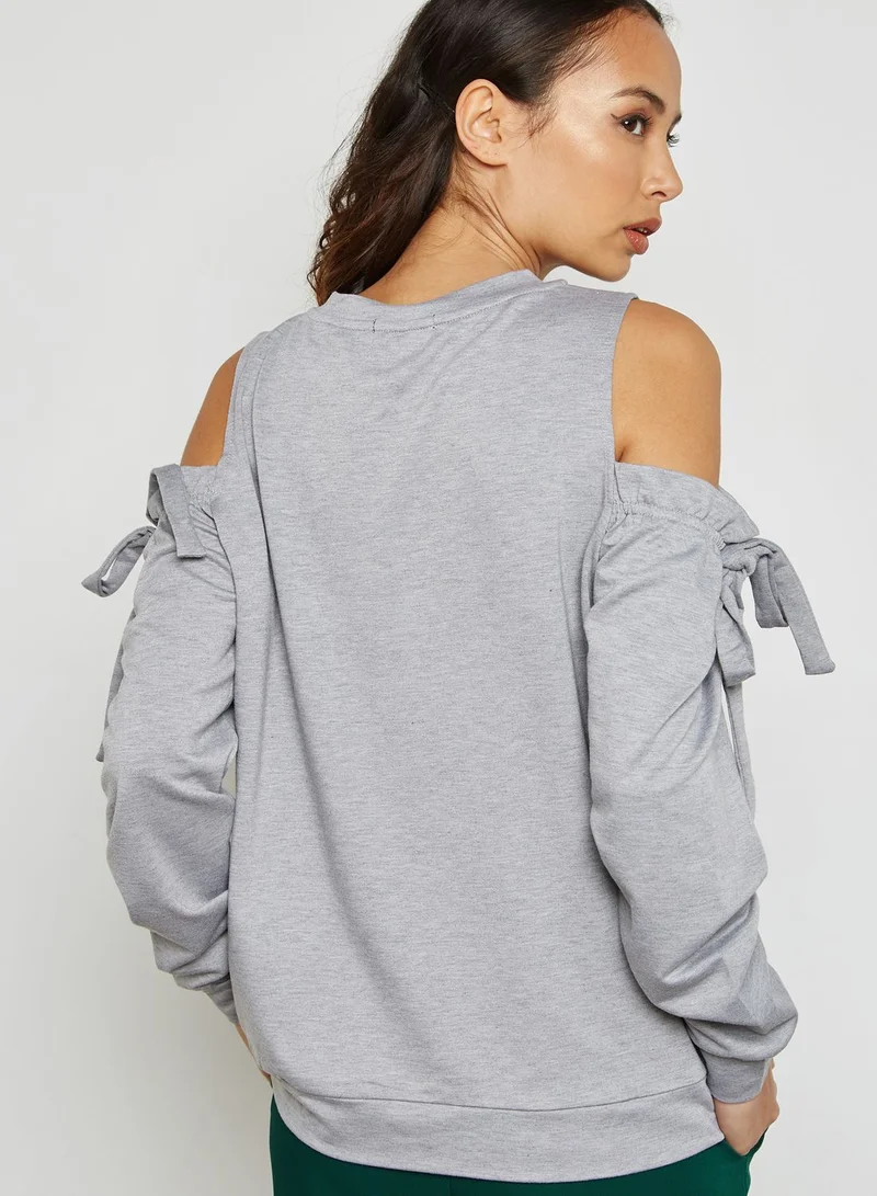 LUMIERE Cold Shoulder Frill Sweater