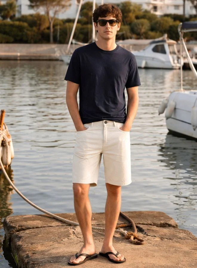 The Indian Garage Co  Men Regular Fit Solid Scoop Pocket Mid-Rise Denim Shorts  | Best Price UAE