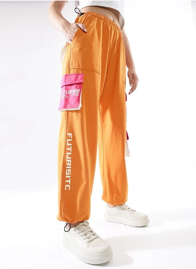 هوبرهولمي Women Track Pants in Multicolor featuring Jogger fit with a printed pattern, no sleeves, regular length, secured with elasicated + drawstring closure, crafted from terry – an essential addition to your stylish collection.