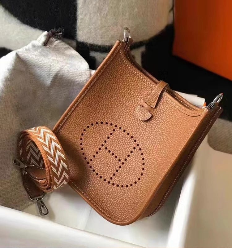 Togo Top Layer Cowhide Leather Hollow out Evelyn Crossbody Single Shoulder Bag Womens Genuine Leather Bag City Simple Style golden brown 