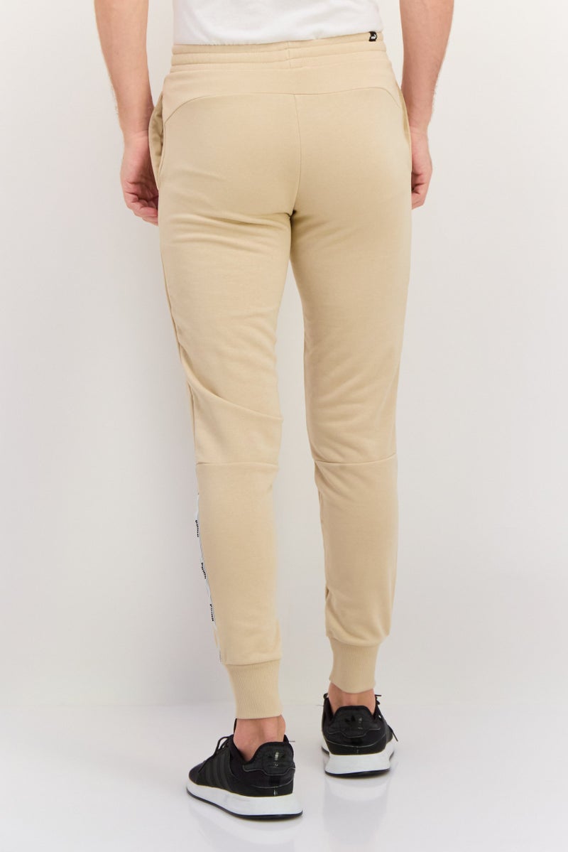 PUMA Men Sportswear Fit Drawstring Training Pants, Beige - Image 3