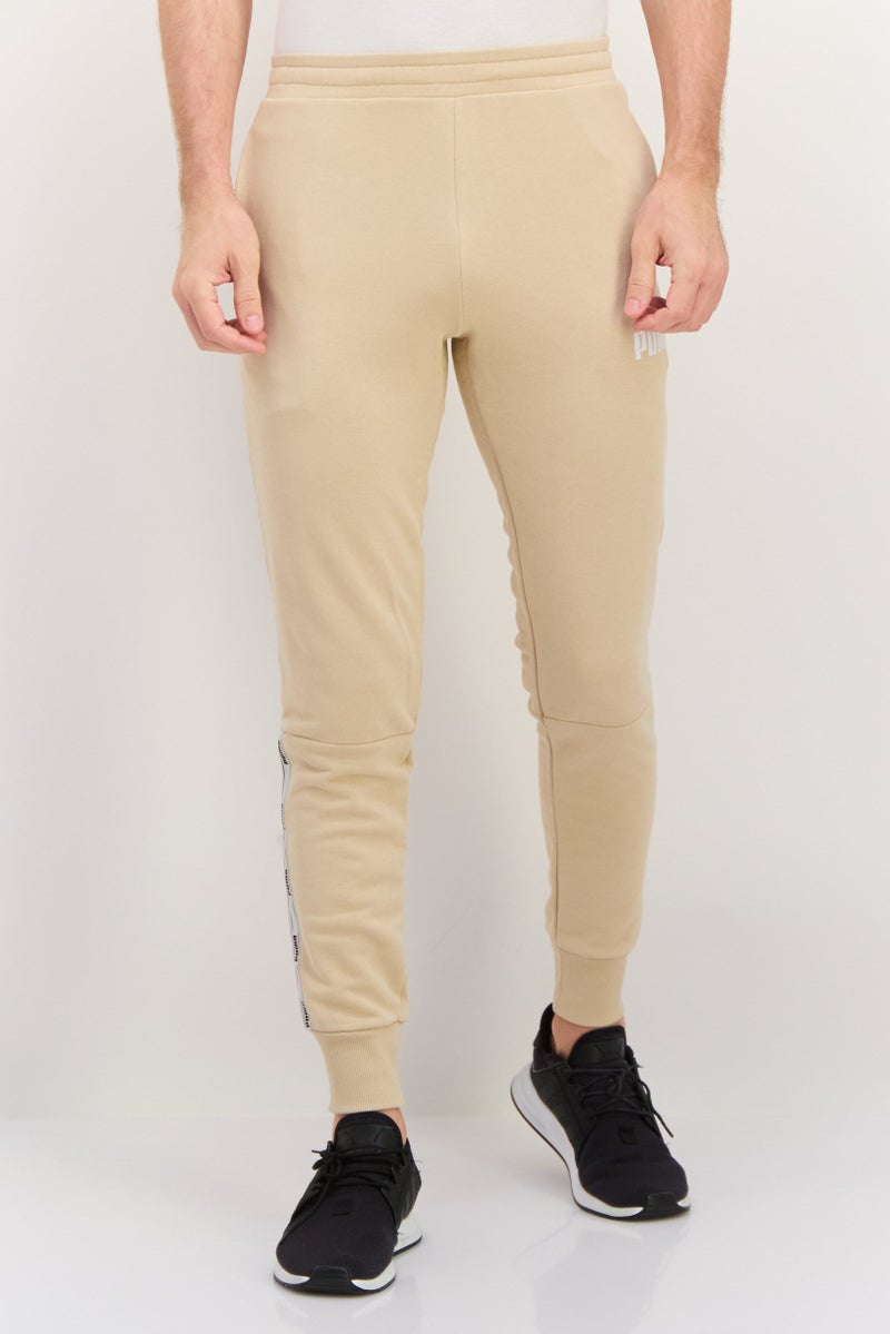 PUMA Men Sportswear Fit Drawstring Training Pants, Beige - Image 1