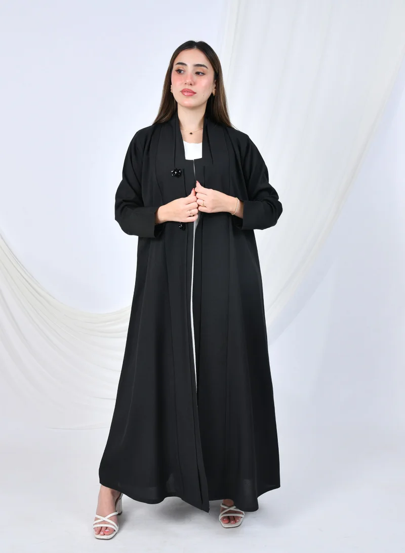 HAWRAA ABAYA Black formal abaya with a simple A-line design, embellished with floral buttons for a feminine touch