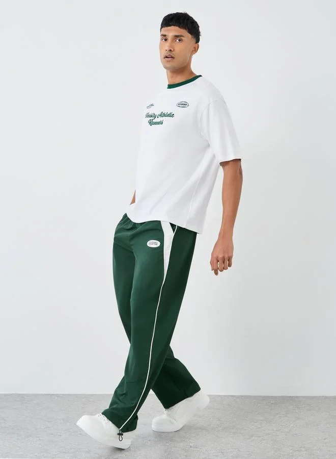 Styli Styli Green Relaxed Fit Joggers with Side Piping and Placement Print