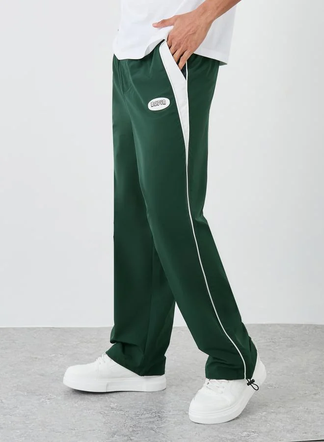 Styli Styli Green Relaxed Fit Joggers with Side Piping and Placement Print