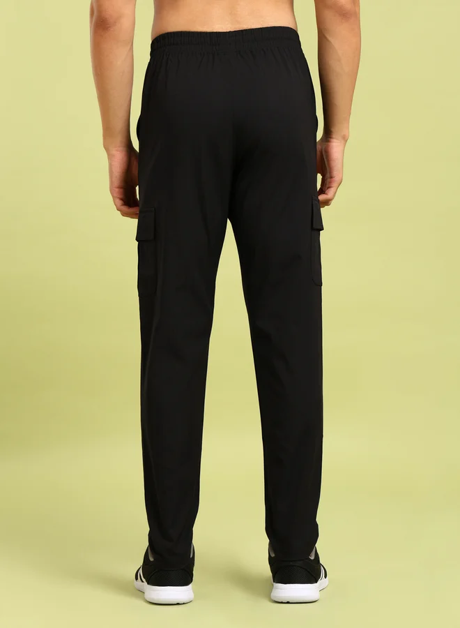 تكنوسبورت بنطلون كارجو مطاطي ثنائي الاتجاه بلون سادة